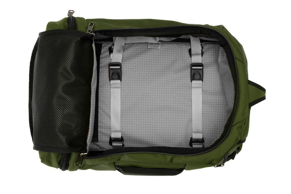 An open Techonaut 30 with a Saguaro (olive green) exterior and an Zest (orange) interior.